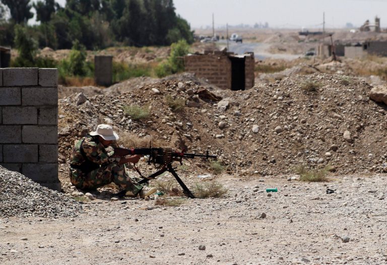 A Shiite militiaman takes his combat position in Amirli, Iraq, on Sunday. (AP)