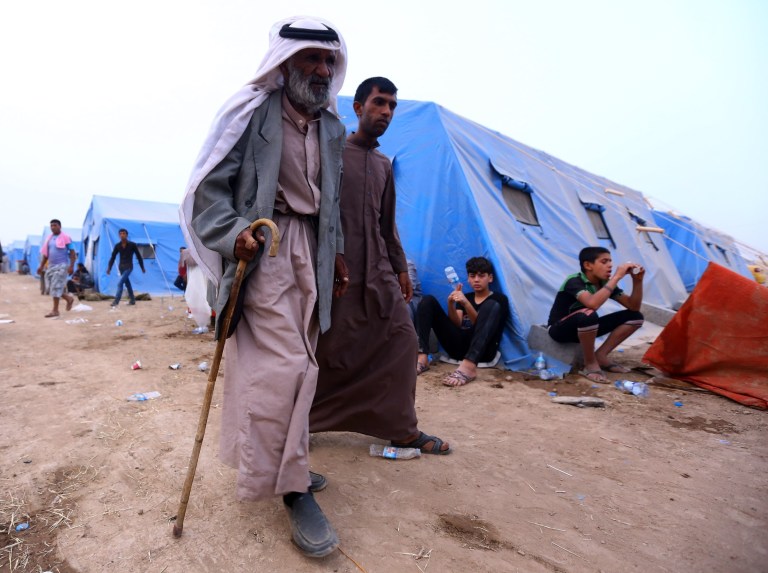 Iraqi refugees from Mosul arrive at Khazir refugee camp outside Irbil, 217 miles (350 kilometers) north of Baghdad, Iraq, Thursday, June 12, 2014. The Islamic State of Iraq and the Levant, the al-Qaida breakaway group, on Monday and Tuesday took over much of Mosul in Iraq and then swept into the city of Tikrit further south. An estimated half a million residents fled Mosul, the economically important city. (AP Photo)