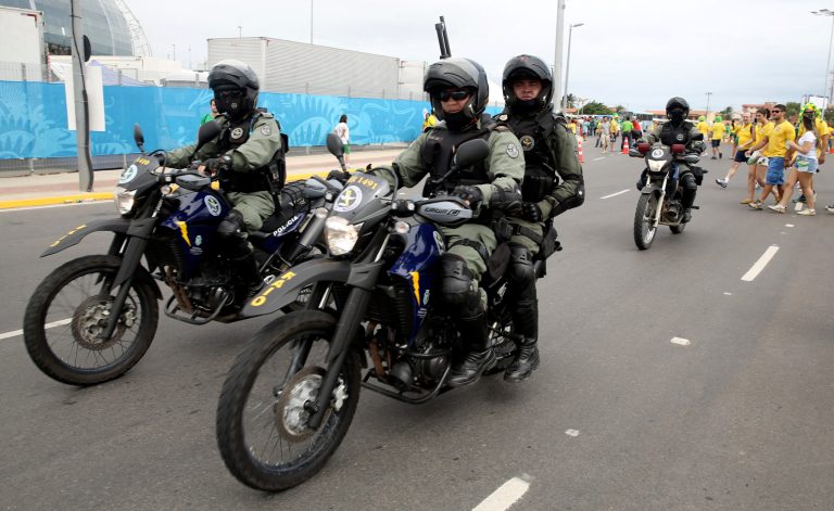 Security patrol outside the stadium ahead of the group A World Cup soccer match between Brazil and Mexico at the Arena Castelao in Fortaleza, Brazil, Tuesday, June 17, 2014.  (AP Photo/Martin Mejia)