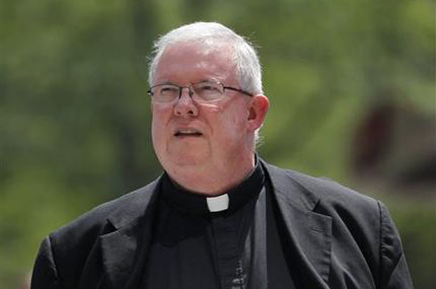 Monsignor William Lynn walks to the Criminal Justice Center, Wednesday, June 20, 2012, in Philadelphia. Lynn is the first Roman Catholic church official in the U.S. ever charged with child endangerment, for allegedly keeping co-defendants former priest Edward V. Avery and the Rev. James J. Brennan, and other accused predators, in ministry. (AP Photo/Matt Rourke)