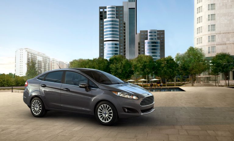 This undated product image provided Ford shows the 2014 Ford Fiesta sedan. The 2014 Fiesta four door with SE EcoBoost package has government fuel economy ratings as high as those for some diesel-powered sedans from BMW, Audi and Volkswagen. (AP Photo/Ford)