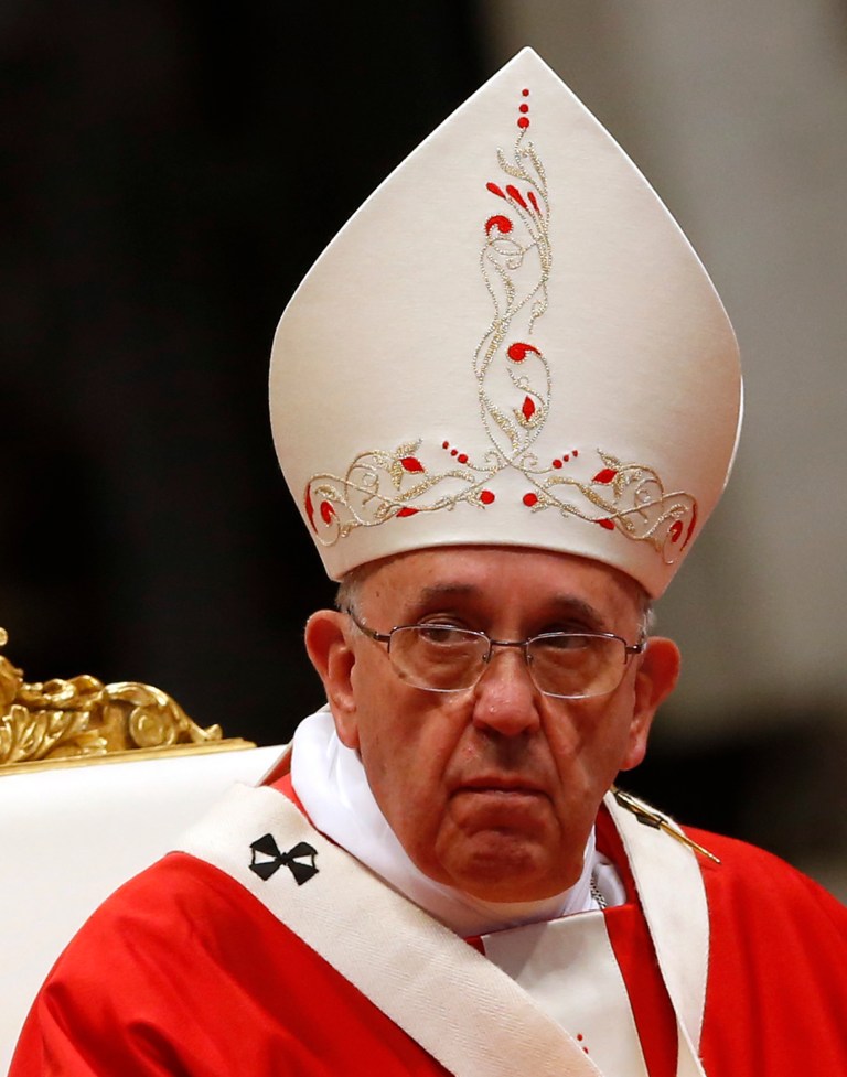 Pope Francis celebrates a mass where he bestowed the Pallium, a woolen shawl symbolizing their bond to the pope, to 24 new new Metropolitan Archbishops, in St. Peter's Basilica at the Vatican, Sunday, June 29, 2014. (AP Photo/Riccardo De Luca)