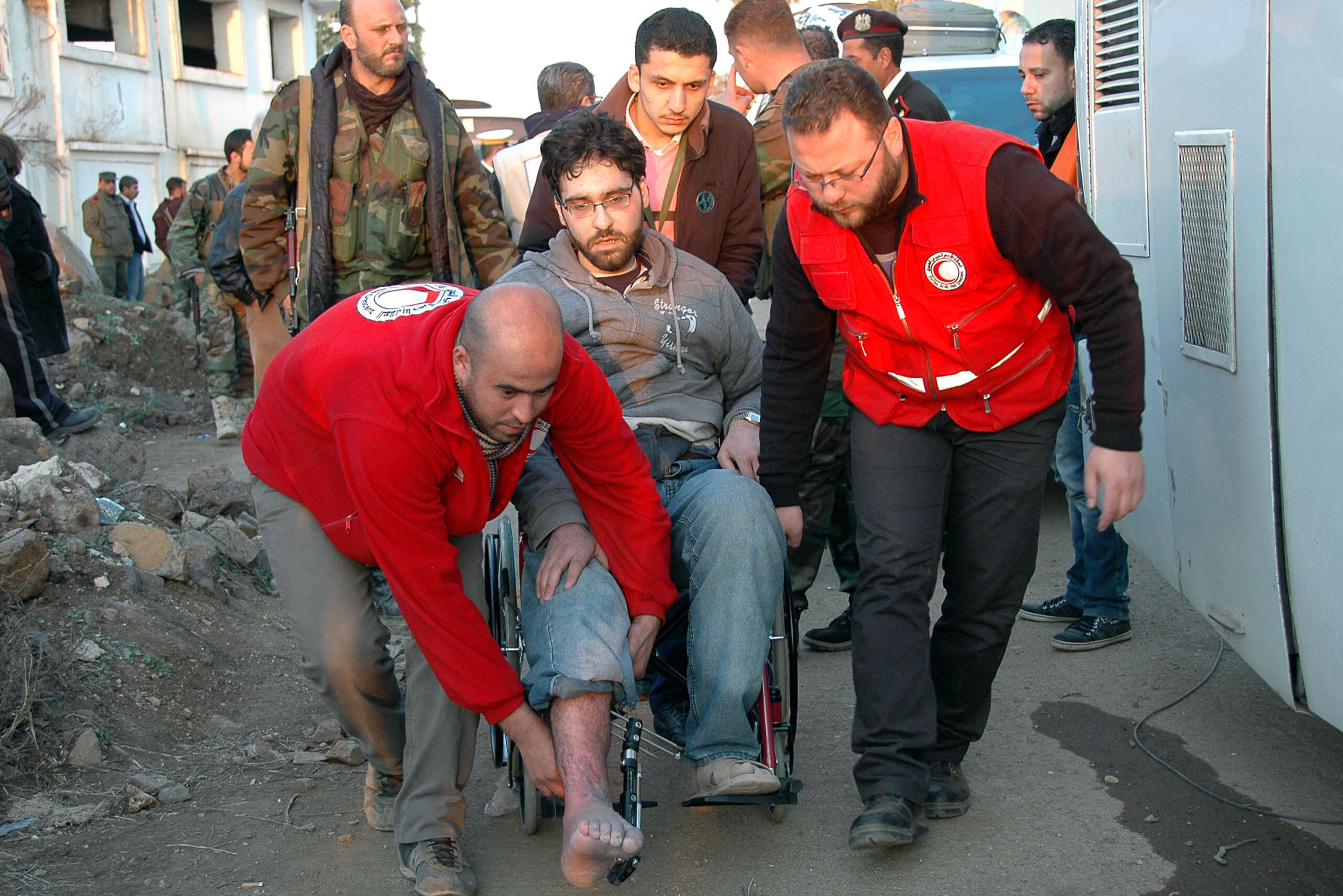 A rush to evacuate as truce extended in Syria city