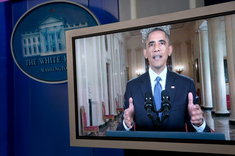 President Obama is seen on a monitor in the briefing room of the White House in Washington, Thursday, Nov. 20, 2014, as he speaks to the nation from the White House about his executive action that will affect millions of immigrants living illegally in the US. (AP Photo/Jacquelyn Martin)