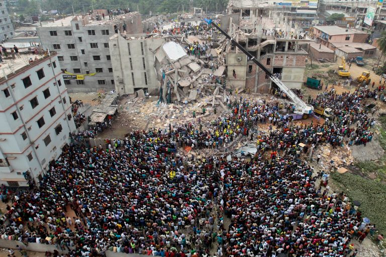 Bangladeshi people gather as rescuers look for survivors and victims at the site of a building that collapsed Wednesday in Savar, near Dhaka, Bangladesh,Thursday, April 25, 2013. By Thursday, the death toll reached at least 194 people as rescuers continued to search for injured and missing, after a huge section of an eight-story building that housed several garment factories splintered into a pile of concrete. (AP Photo/A.M.Ahad)