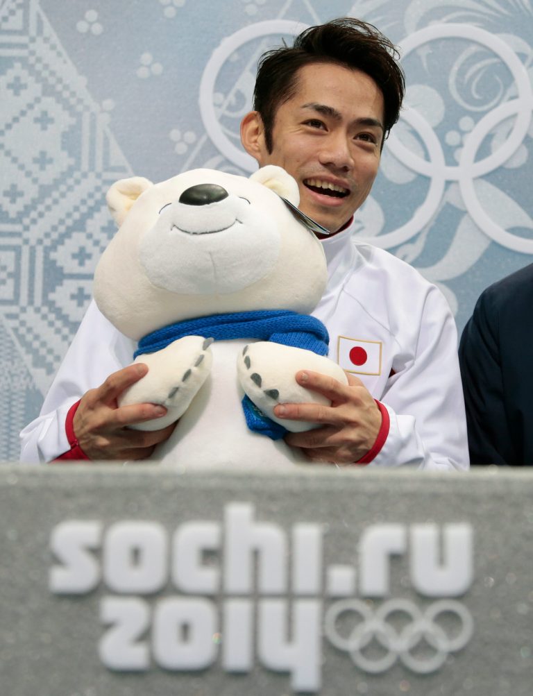 Daisuke Takahashi of Japan waits for his results after the men's free skate figure skating final at the Iceberg Skating Palace at the 2014 Winter Olympics, Friday, Feb. 14, 2014, in Sochi, Russia. (AP Photo/Ivan Sekretarev)