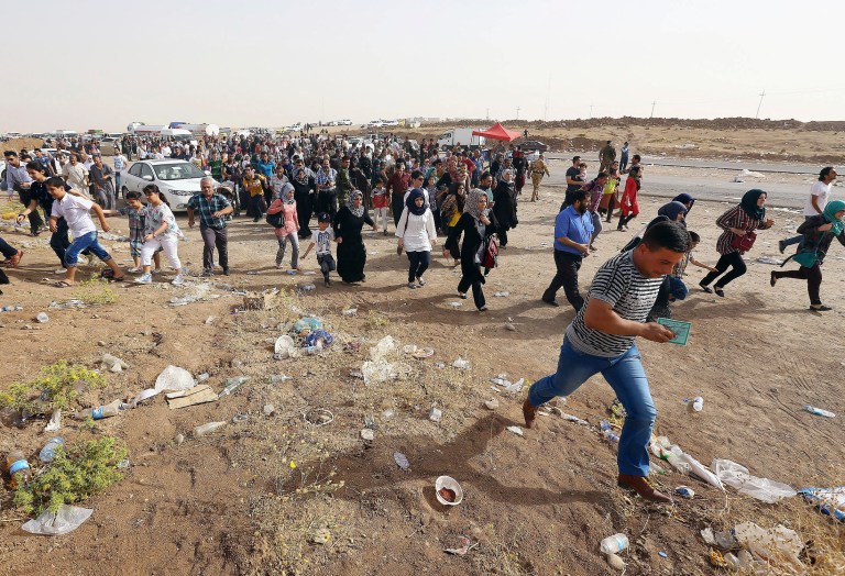 Refugees fleeing from Mosul head to the self-ruled northern Kurdish region in Irbil, Iraq, north of Baghdad, Thursday. (AP)