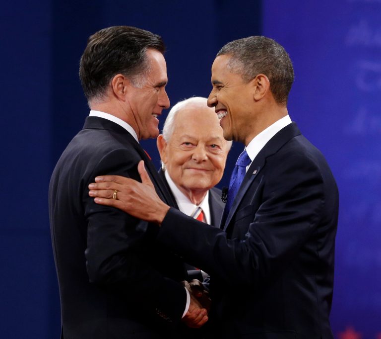 Moderator Bob Schieffer, center, watches as Republican presidential candidate, former Massachusetts Gov. Mitt Romney and President Barack Obama shake hands before the start of the last debate at Lynn University, Monday, Oct. 22, 2012, in Boca Raton, Fla. (AP Photo/Pablo Martinez Monsivais)