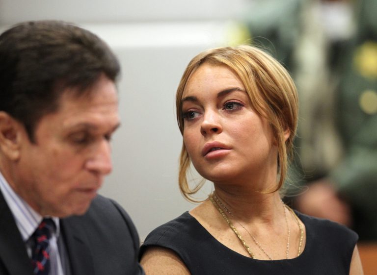LOS ANGELES, CA - JANUARY 30:  Troubled actress Lindsay Lohan appears in court for a pretrial hearing with her new lawyer Mark Heller before Judge Stephanie Sautner at the Airport Branch Courthouse of Los Angeles Superior Court on January 30, 2013 in Los Angeles, California. Lohan is charged with three misdemeanor counts involving a car crash - willfully resisting, obstructing or delaying an officer, providing false information to an officer and reckless driving. She is also accused of violating her probation in a misdemeanor jewelry theft case.  (Photo by David McNew/Getty Images)