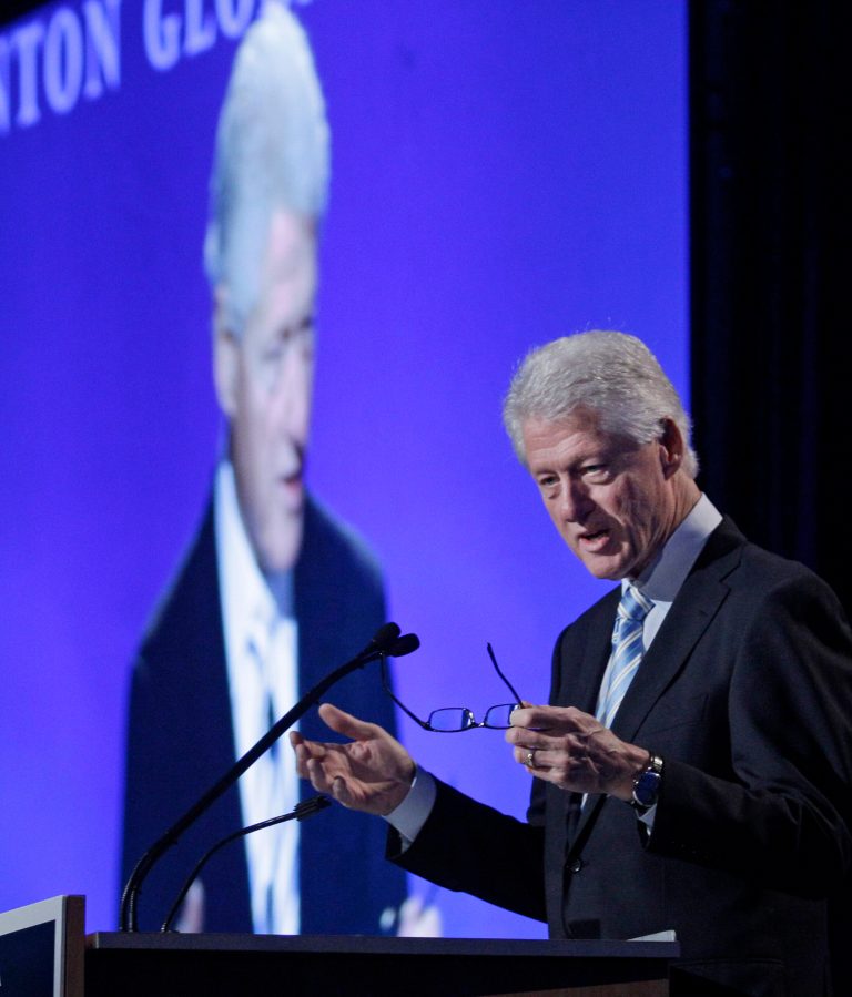   Former President Bill Clinton speaks at the second annual Clinton Global Initiative America, Thursday, June 7, 2012, in Chicago. Clinton urged those attending the two-day event to invest in projects that will create jobs. Among the goals, he said, were to share ideas in the areas of housing recovery, education, clean energy and helping returning war veterans find employment. (AP Photo/M. Spencer Green)  