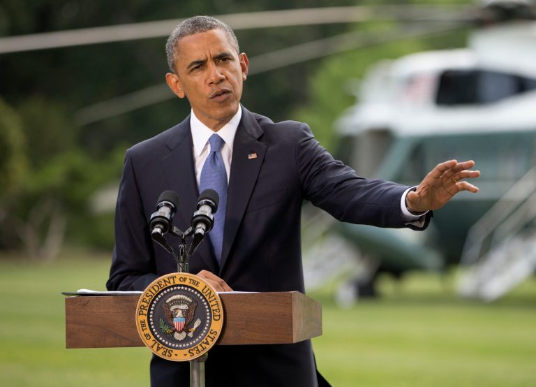 President Barack Obama talks about his administration's response to a growing insurgency foothold in Iraq, Friday, June 13, 2014, on the South Lawn of the White House in Washington, prior to boarding the Marine One Helicopter for Andrews Air Force Base, Md., then onto North Dakota and California. (AP Photo/Pablo Martinez Monsivais)