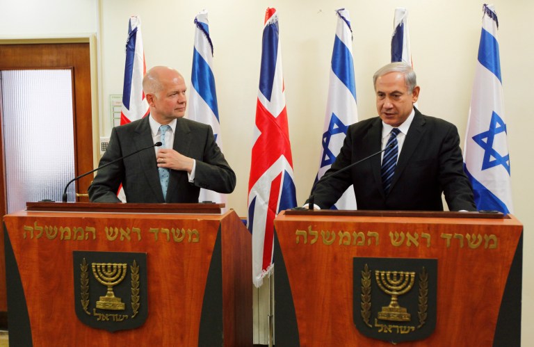 Britain's Foreign Secretary William Hague, left, listens to Israeli Prime Minister Benjamin Netanyahu during a joint news conference before their meeting in Jerusalem, Thursday, May 23, 2013. (AP Photo/Ronen Zvulun, Pool)