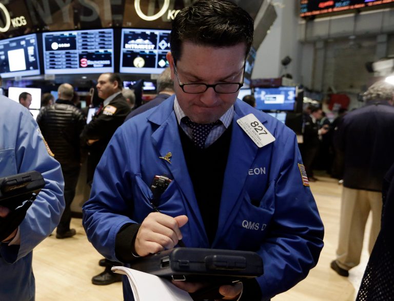 Trader Leon Montana works on the floor of the New York Stock Exchange Friday, Jan. 31, 2014. Stocks fell sharply in early trading Friday, as investors fretted over disappointing earnings from companies like Amazon.com and more trouble in overseas markets. (AP Photo/Richard Drew)