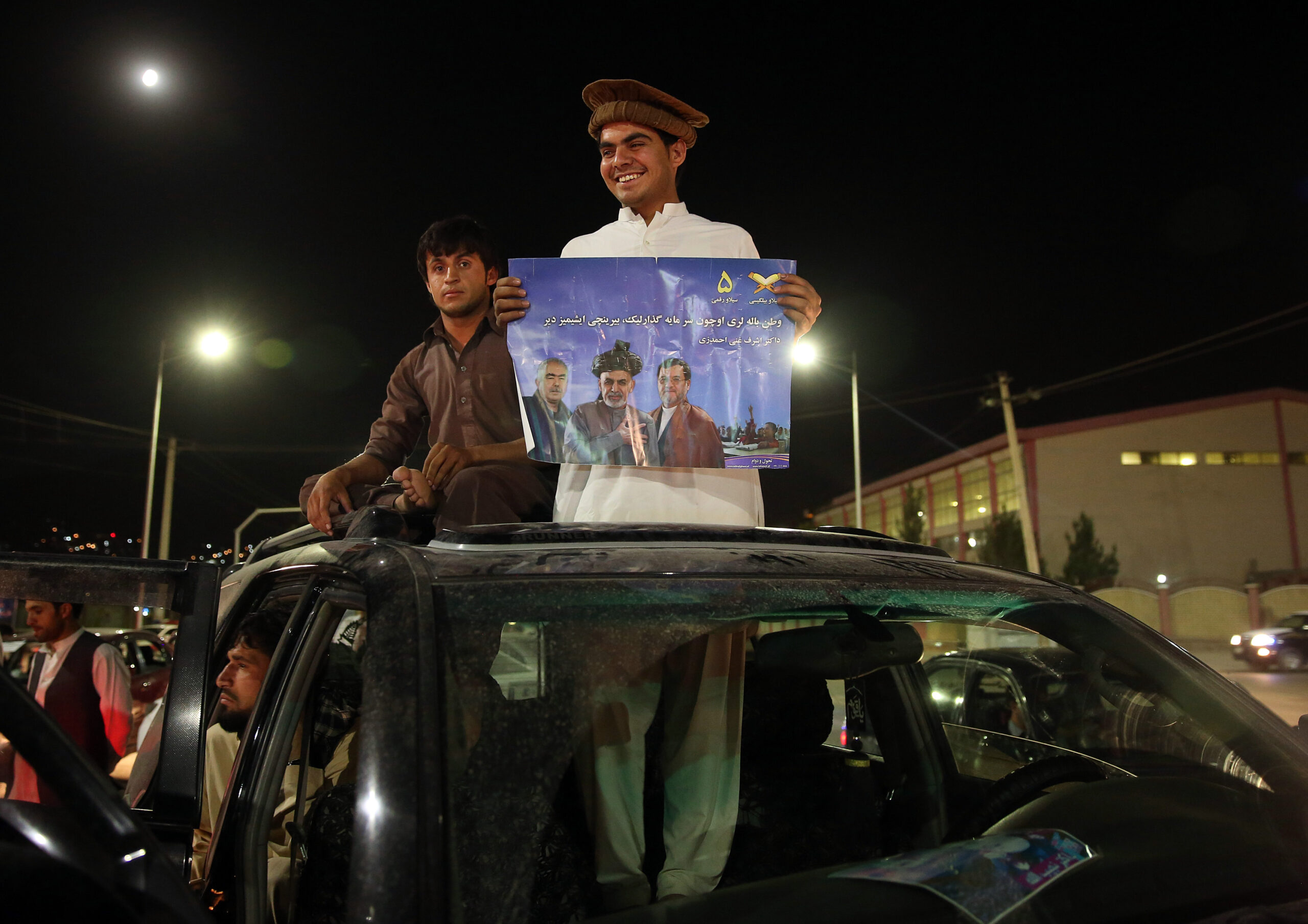 Afghan officials: Ahmadzai leads in disputed vote