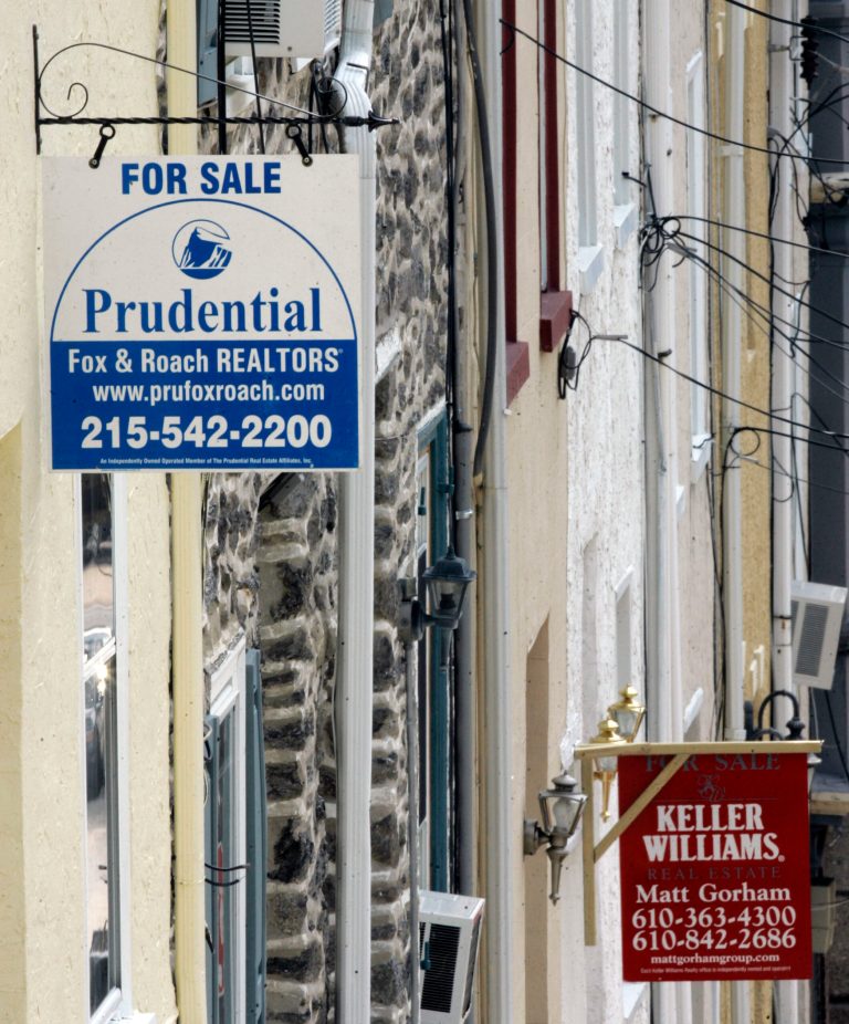 File-This Aug. 16, 2007, file photo shows real estate signs mounted on homes in Philadelphia. A sudden plunge in mortgage rates this week raised an urgent question for millions of Americans: Should I refinance my mortgage? Across the country, homeowners and would-be homeowners eager for a bargain rate fired off inquiries to lenders. The opportunity emerged from the turbulence that seized financial markets and sent stock prices and bond yields tumbling. (AP Photo/Matt Rourke, File)
