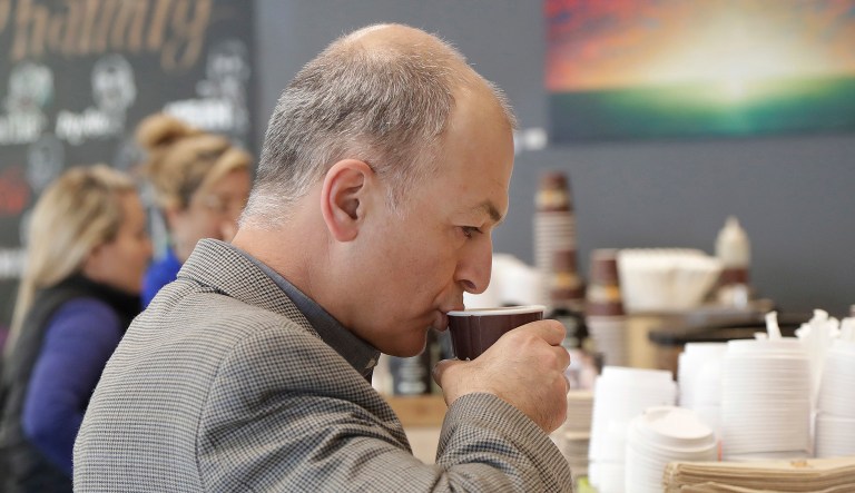 Afshin Afshar takes a sip from a coffee drink he bought at a Philz Coffee shop in San Francisco, Friday, March 30, 2018. Coffee sellers will have to post ominous warnings in California because each cup contains a chemical linked to cancer, a judge ruled. The culprit is a byproduct of the bean roasting process that is a known carcinogen and has been at the heart of an eight-year legal struggle between a tiny nonprofit group and Big Coffee companies.