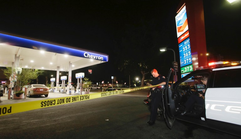 Garden Grove police stand watch at the scene of a stabbing in Garden Grove, Calif., Wednesday, Aug. 7, 2019.