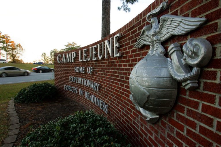 Cars enter the main gate at Camp Lejeune in Jacksonville, North Carolina on Friday, Dec. 2, 2005. 