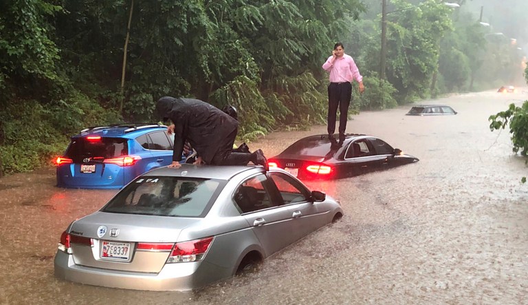 Motorists are stranded on a flooded section of Canal Road in Washington during a heavy rainstorm, Monday, July 8, 2019.