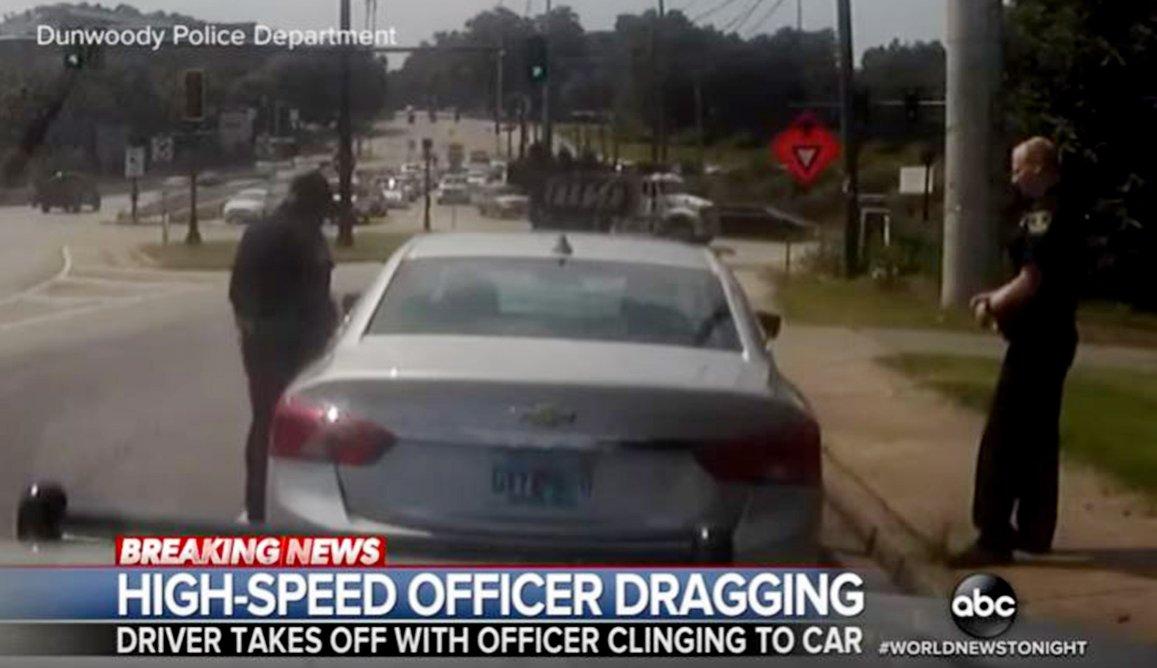 WATCH: Police officer dragged onto freeway as he dangles from suspect’s car after traffic stop