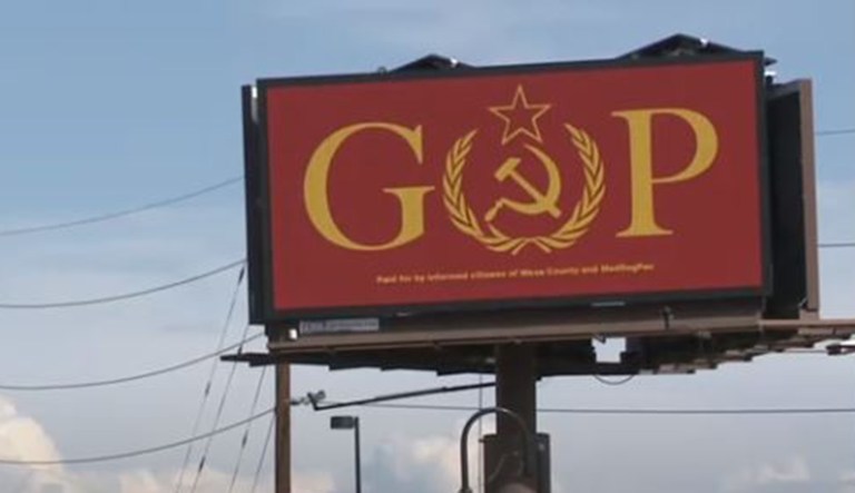A sign in Grand Junction, Colo., spells out the Republican Party's abbreviation, "GOP," but with the hammer and sickle replacing the "O."