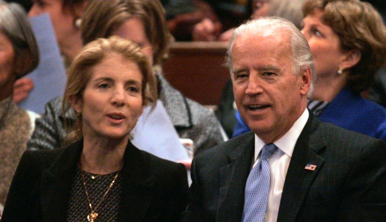 Caroline Kennedy, left, daughter of President John F. Kennedy, speaks with Vice President-elect Joe Biden, right, before the start of a special convocation held to present Sen. Edward M. Kennedy, D-Mass., not shown, with an honorary degree at Harvard University, in Cambridge, Mass., Monday, Dec. 1, 2008.