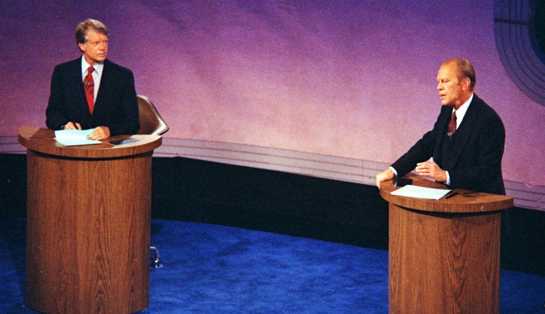 In this Sept. 23, 1976, file photo President Gerald Ford speaks during the first of three televised presidential debates with Democratic presidential candidate Jimmy Carter at Philadelphia's Walnut Street Theater.