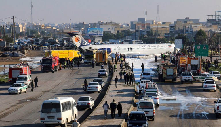 An Iranian passenger plane sits on a road outside Mahshahr airport after skidding off the runway, in southwestern city of Mahshahr, Iran, Monday, Jan. 27, 2020. An Iranian passenger airliner carrying some 150 passengers skidded off the runway and into a street next to the airport in the southern city of Mahshahr on Monday, after apparently losing its landing gear in a hard landing.