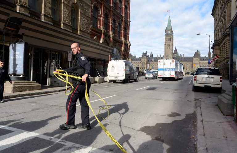 Police cordon off a street leading to Parliament Hill in Ottawa on Wednesday, Oct. 22, 2014. (AP Photo/The Canadian Press, Adrian Wyld)