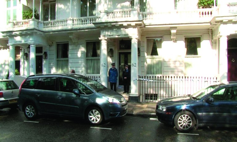 This photo taken from PA video shows police outside a house in Cadogan Place, Chelsea after the body of Eva Rausing, a member of the family behind the Tetra-Pak drinks carton empire and one of the richest women in Britain was found, Tuesday July 10, 2012. Eva Rausing, one of Britain's richest women, was found dead in her west London home and a man has been arrested in connection with her death, British police said Tuesday. Rausing, 48, was the American-born wife of Hans Kristian Rausing, heir to the multibillion-dollar TetraPak packaging fortune. They have both had long-running and often public battles against addiction. (AP Photo/PA Video, Leanne Rinne) UNITED KINGDOM OUT NO SALES NO ARCHIVE