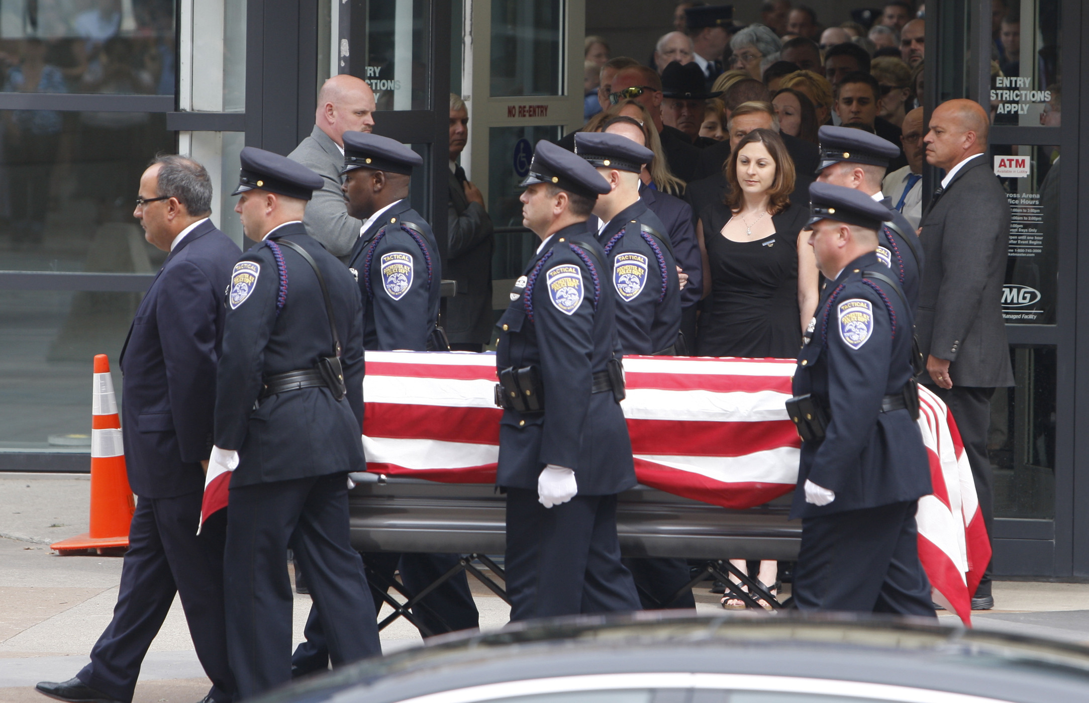 Slain Rochester officer praised, mourned at arena