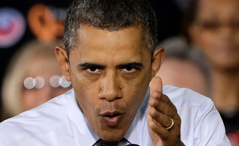   President Barack Obama gestures as he speaks to workers about the economy during a visit to Daimler Detroit Diesel in Redford, Mich., Monday, Dec. 10, 2012. (AP Photo/Paul Sancya)  