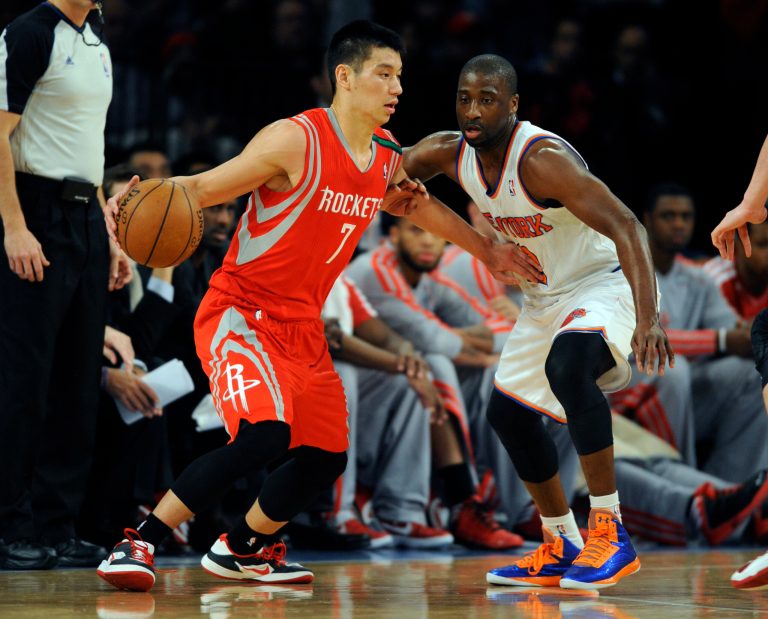   Houston Rockets' Jeremy Lin, left, drives on New York Knicks' Raymond Felton in the first quarter of an NBA basketball game at Madison Square Garden in New York, Monday, Dec. 17, 2012. (AP Photo/Henny Ray Abrams)  