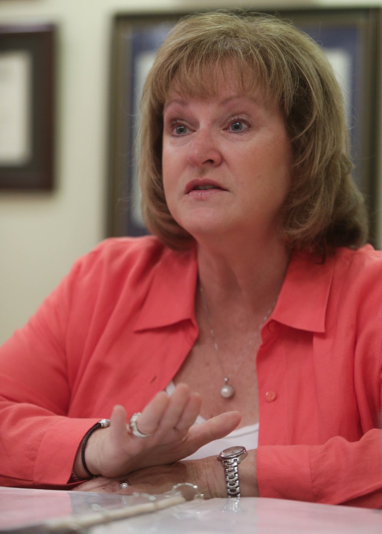 Wendy Kozma of Novi, Mich., talks about her mentally disabled daughter Jodi Renee Kozma, 25, on Thursday June 12, 2014, at the law offices of Deborah Gordon in Bloomfield Hills, Mich. The Kozmas are suing Wal-Mart and police after their daughter was stopped for suspected shoplifting at a Walmart in Livonia, Mich. Kozma says her 25-year-old daughter, Jodi, who has the mental capacity of an 8-year-old, now is terrified of police after being handcuffed and questioned  in 2012. Records show she didn't steal anything. (AP Photo/Detroit Free Press, Ryan Garza)  DETROIT NEWS OUT;  NO SALES