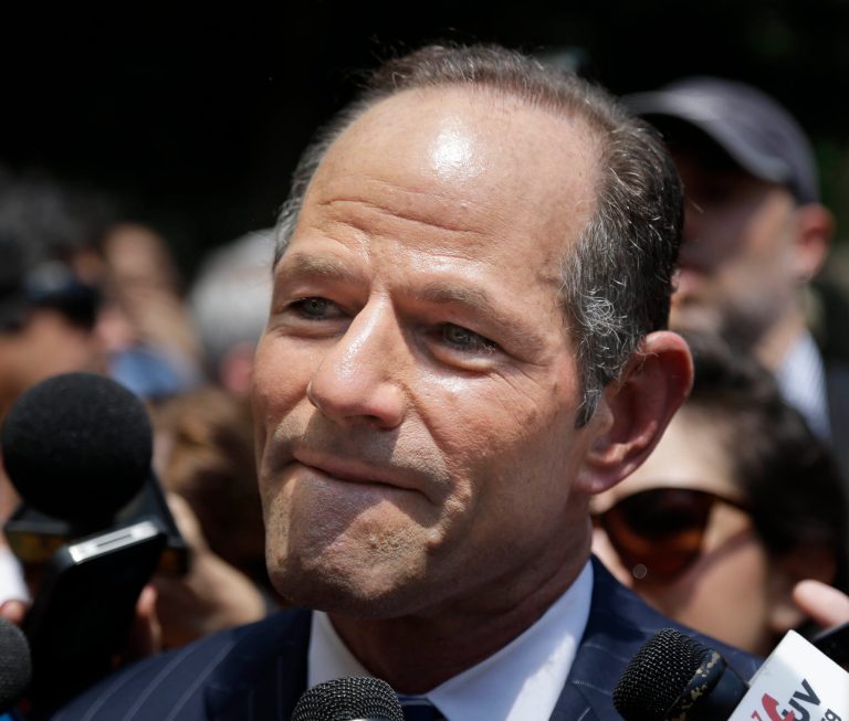 Former New York Gov. Eliot Spitzer is surrounded by media as he tries to collect signatures for his run for New York City Comptroller in New York, Monday, July 8, 2013. Spitzer, who stepped down in 2008 amid a prostitution scandal, says he is planning a political comeback with a run for New York City comptroller. (AP Photo/Seth Wenig)