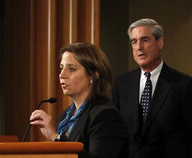 FILE - In this Oct. 11, 2011, file photo Lisa Monaco speaks during a Justice Department news conference with FBI Director Robert Mueller, right, in Washington. After one of his most strenuous weeks as President Barack Obama went to his residence when an urgent email brought him rushing back to the Oval Office. 