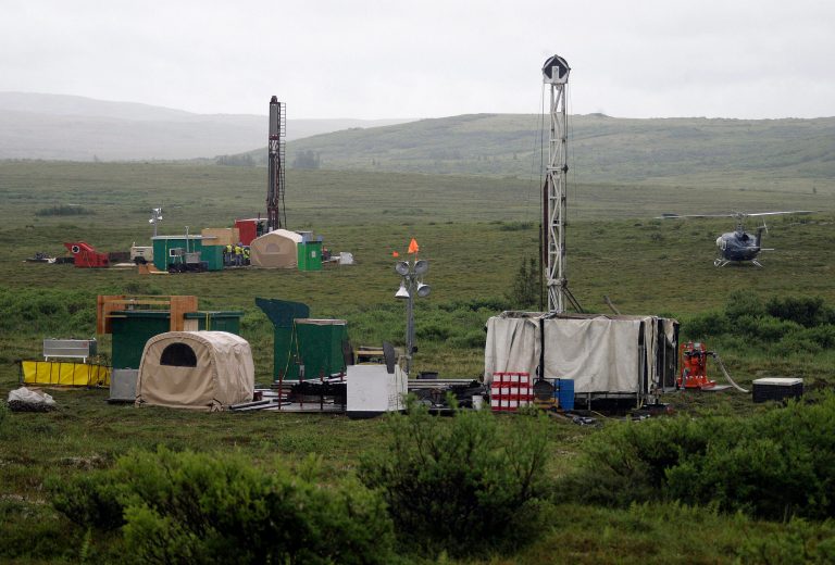 FILE - In this July 13, 2007 file photo, workers with the Pebble Mine project test drill in the Bristol Bay region of Alaska near the village of Iliamma, Alaska. The battle over a copper and gold mine near one of the world's premiere salmon fisheries is headed to the ballot in a vote next week that has turned a normally sleepy local election into a national environmental debate. (AP Photo/Al Grillo, File)
