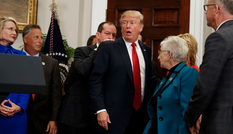 Following Trump's remarks about the action, he turned to his left and walked over to lawmakers. He greeted them and shook hands as he moved to exit the room. (AP Photo/Evan Vucci)