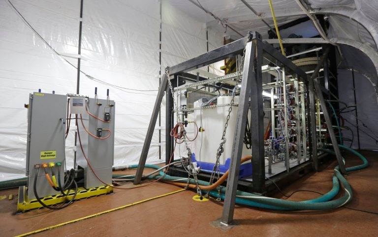 FILE - This Thursday Jan. 2, 2014 file photo shows one of the two field deployable hydrolysis units aboard the M/V Cape Ray in Portsmouth, Va. The M/V Cape Ray departed Monday, Jan. 27, 2014, on a mission to destroy dozens of containers of deadly chemical weapons being removed from Syria as part of international efforts to dismantle that country's poison gas and nerve agent program. (AP Photo/Steve Helber)