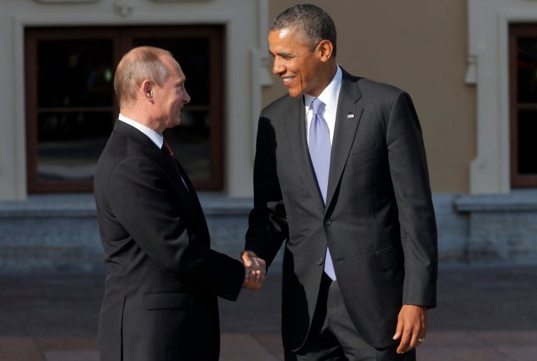 Russian President Vladimir Putin, left, greets President Obama during arrivals for the G-20 summit at the Konstantin Palace in St. Petersburg, Russia, on Sept. 5. (AP Photo/Dmitry Lovetsky)