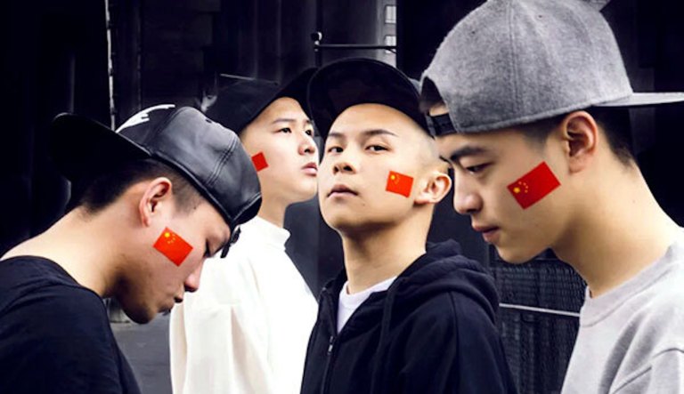 Chinese rap group singing Olympic theme song has history of threats, blamed COVID-19 on US