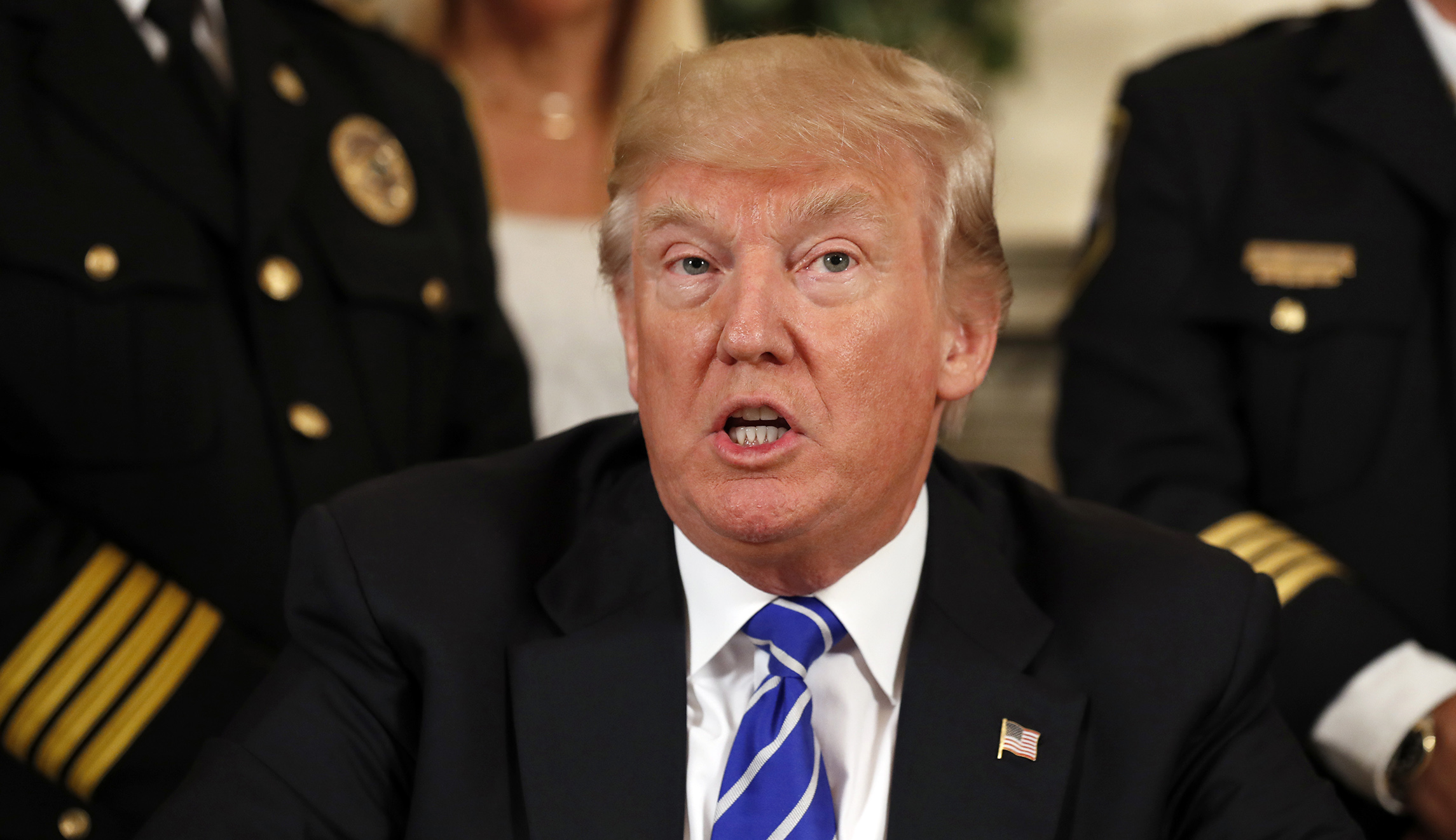 Trump attacks his own Justice Department over blocked travel ban