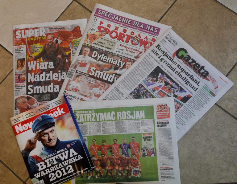   Front pages of newspapers and magazines are spread out for a photograph a day before of the Euro 2012 soccer championship Group A match between Poland and Russia in Wroclaw, Poland, Monday, June 11, 2012. Polish papers went to town Monday on references to Poland's victorious 1920 battle against the Bolshevik Army, known as the Miracle on the Vistula, fueling simmering nationalist sentiments on the eve of the Group A match at the National Stadium. (AP Photo/Petr David Josek)  