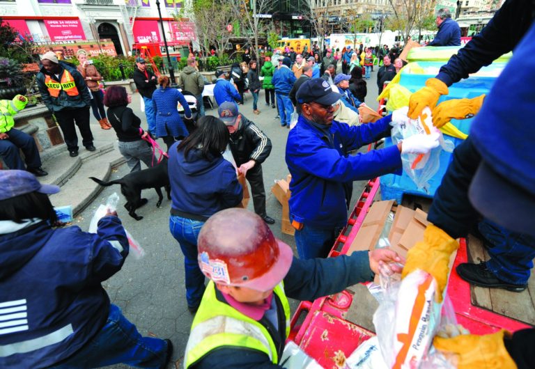 Dry ice is unloaded from a flatbed truck in Union Square for distribution to residents of the still powerless Chelsea section of Manhattan, Thursday, Nov.1, 2012, in New York. Three days after superstorm Sandy walloped the city, residents and commuters still faced obstacles as they tried to return to pre-storm routines. (AP Photo/ Louis Lanzano)