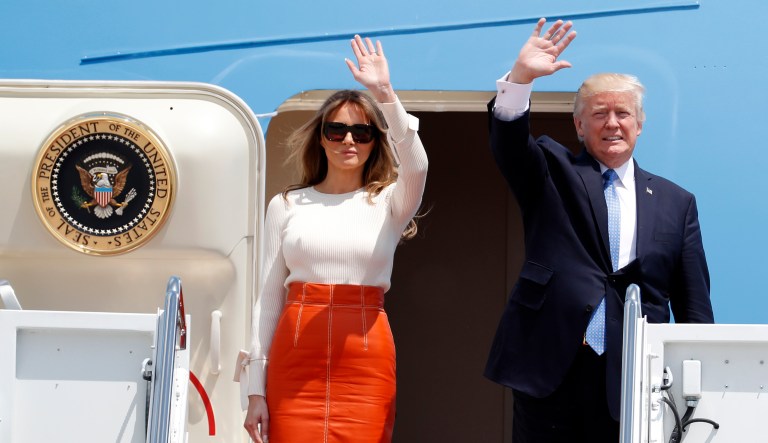 President Trump and first lady Melania Trump, wave as they board Air Force One, prior to his departure on his first overseas trip. (AP Photo/Alex Brandon)