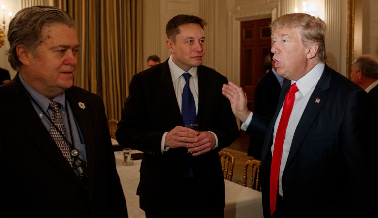 President Trump talks with Tesla and SpaceX CEO Elon Musk, center, and White House chief strategist Steve Bannon during a meeting with business leaders in the White House. Musk fled Trump's orbit after the president pulled the U.S. out of the Paris climate treaty, which could enrich Musk's subsidy-dependent companies. (AP Photo/Evan Vucci)