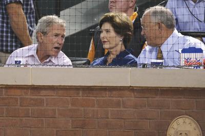 Harry How/Getty Images
Nolan Ryan sat with a former owner of the Rangers--former President George W. Bush--during Game 1 of the ALCS.