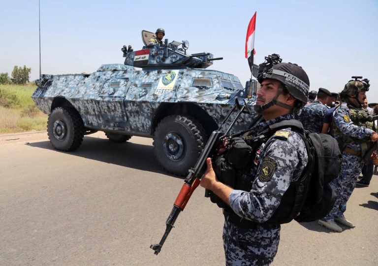 Iraqi federal policemen patrol in Baghdad's Abu Ghraib suburb, Iraq, Saturday, June 28, 2014. Iraqi troops backed by helicopter gunships launched an operation early Saturday aimed at dislodging Sunni militants from the northern city of Tikrit, one of two major urban centers they seized in recent weeks in a dramatic blitz across the country. (AP Photo/Karim Kadim)
