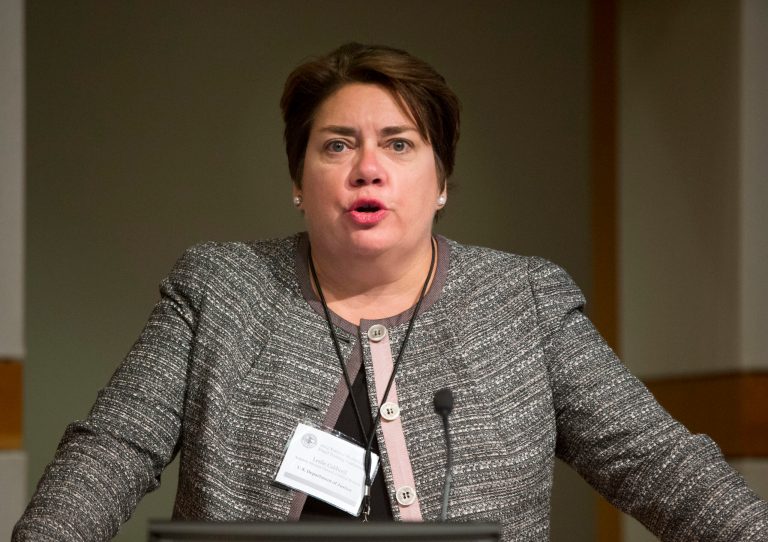 Assistant Attorney General Leslie Caldwell speaks at the Justice Department's Health Care Fraud Training Conference at the Bureau of Alcohol, Tobacco, Firearms and Explosives (ATF) headquarters in Washington, Wednesday, Sept. 10, 2014. Working to combat an increasingly lucrative crime that crosses geographic boundaries, Justice Department officials are pressing for a new law to help them prosecute criminals overseas who traffic in stolen credit cards. Authorities say the current law is too weak because it allows people in other countries to avoid prosecution if they buy and sell stolen card data outside the United States. The Justice Department wants Congress to make it illegal for an international criminal to possess, buy or sell a stolen credit card issued by a U.S. bank, no matter where the transaction occurs. (AP Photo/Pablo Martinez Monsivais)