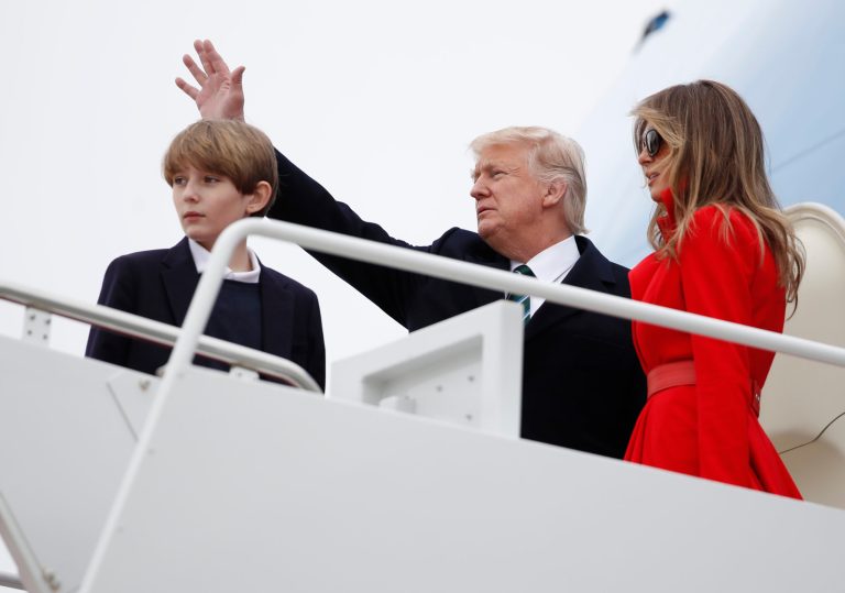 President Donald Trump, with his wife first lady Melania Trump and their son Barron Trump, wave as they board the Air Force One at Andrews Air Force Base, Md., Friday, March 17, 2017, for a trip to Florida. (AP Photo/Manuel Balce Ceneta)